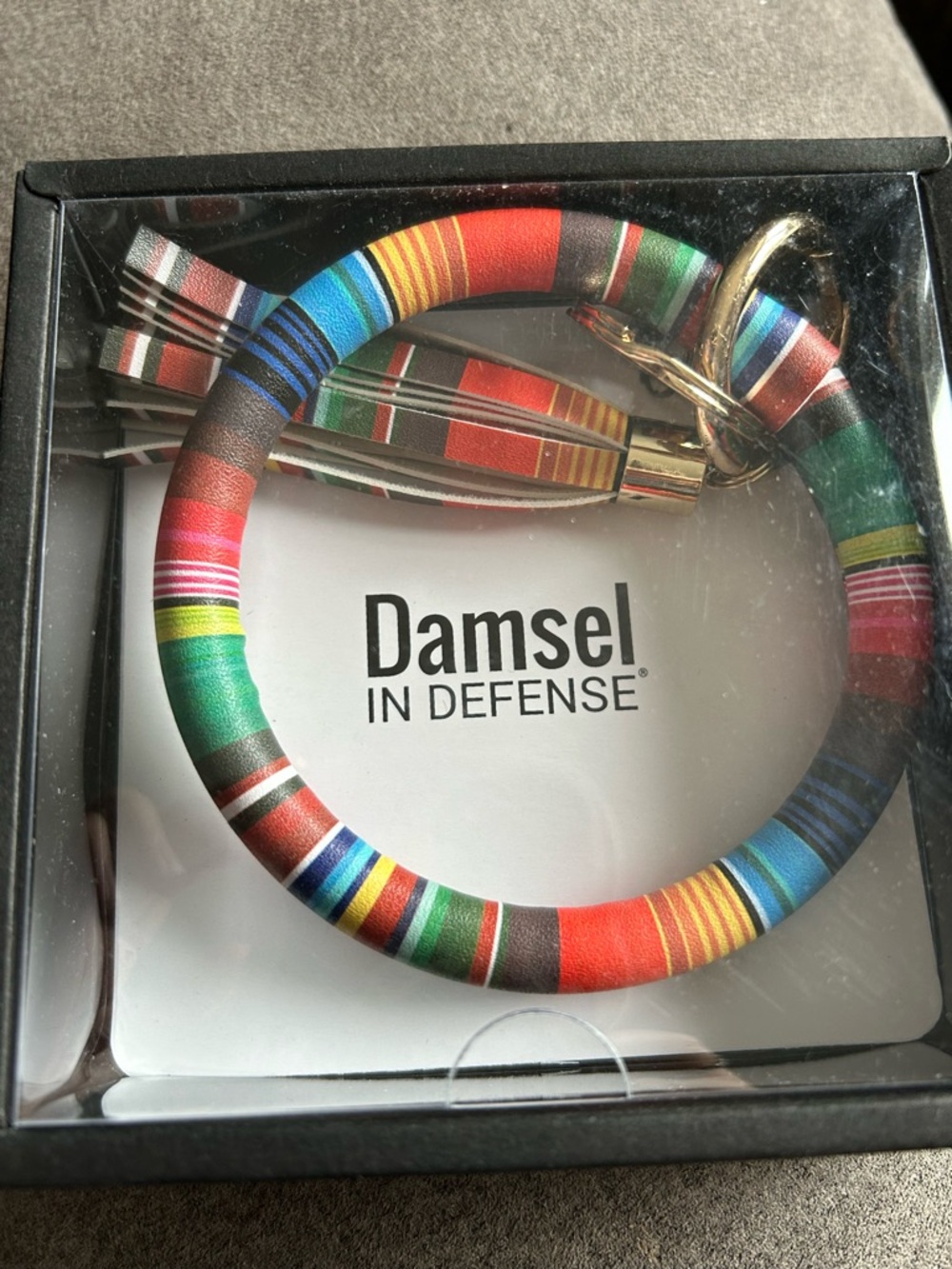 Damsel in Defense breakaway key ring.